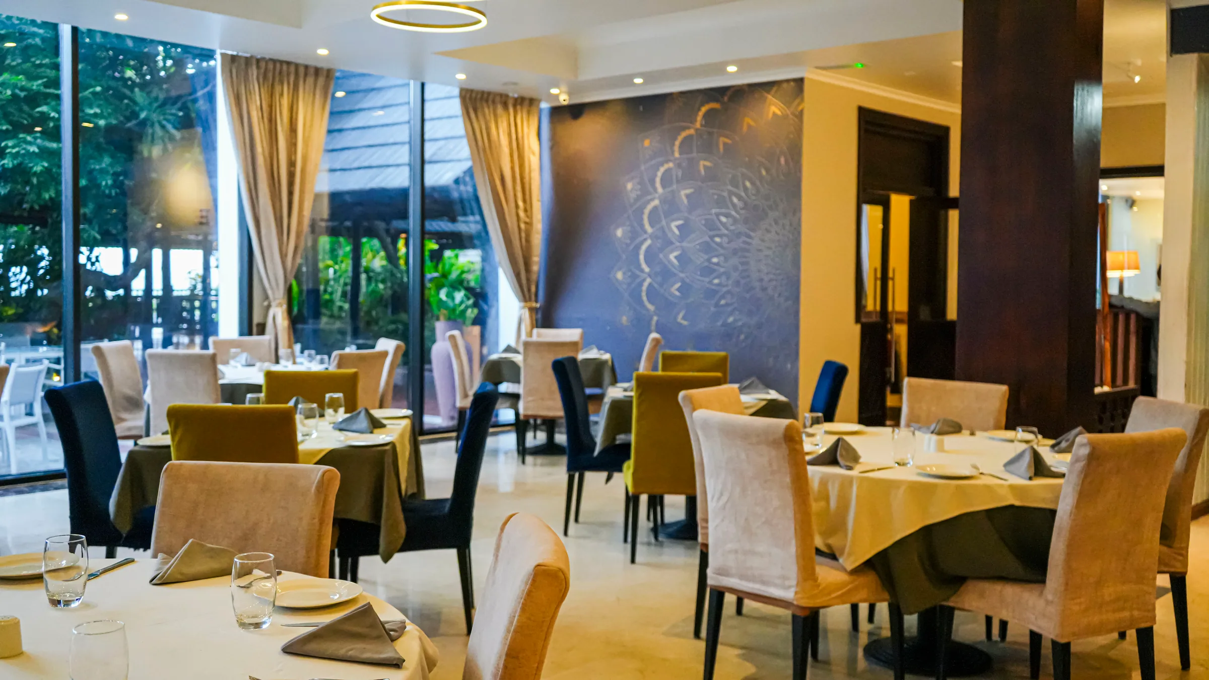 Wide view of The Alcove dining room with elegant table settings